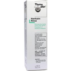 Weiße Verpackung einer Haarspülung mit schwarzem und grünem Text.
